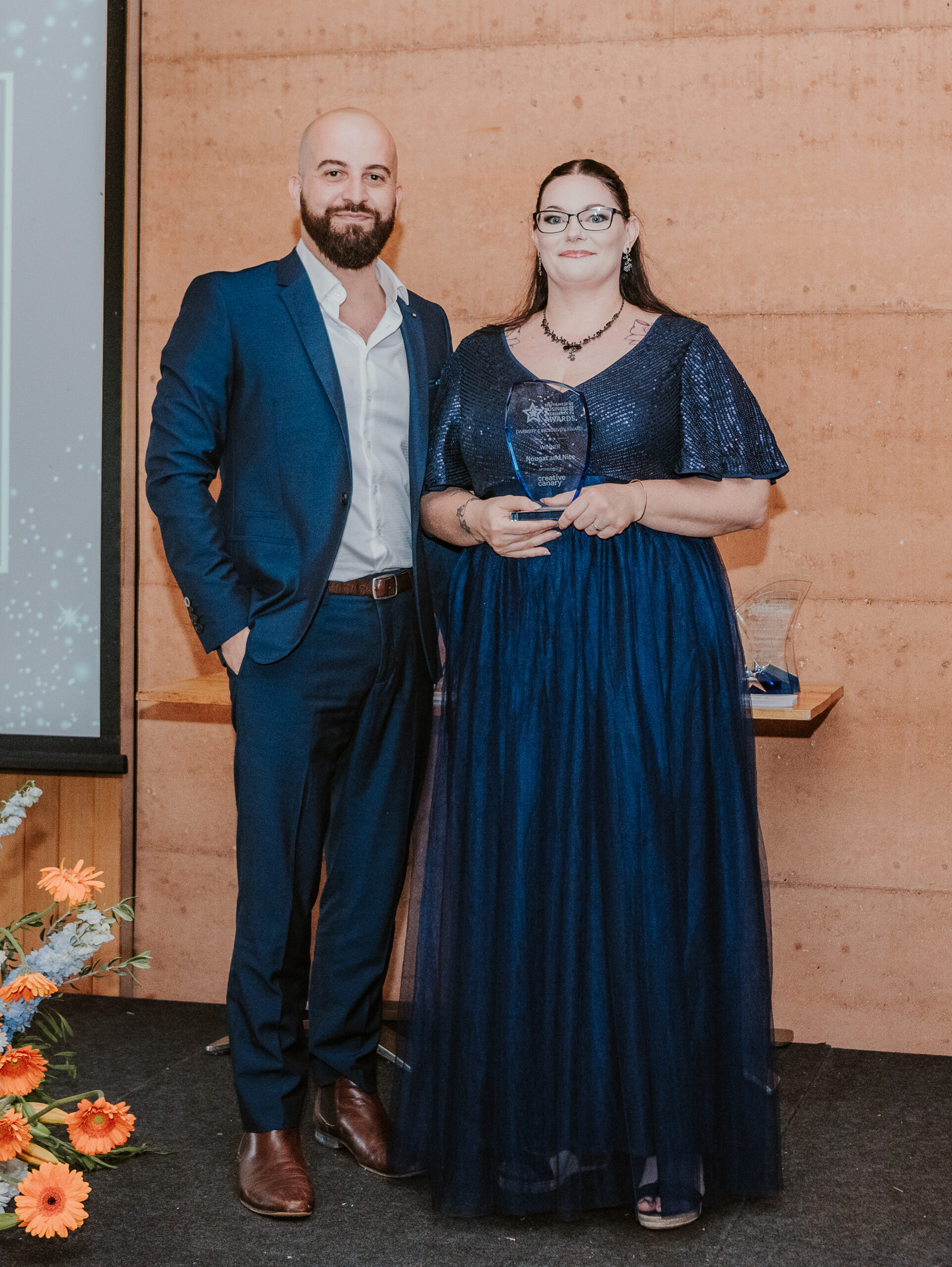 Creative Canary Director Phil giving the Creative Canary Diversity and Inclusivity Award to winner Nougat and Nice